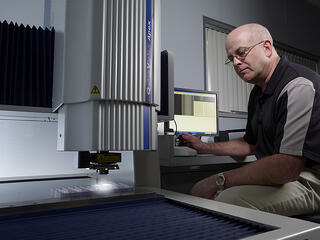 Rodon employee uses machinery in the facility